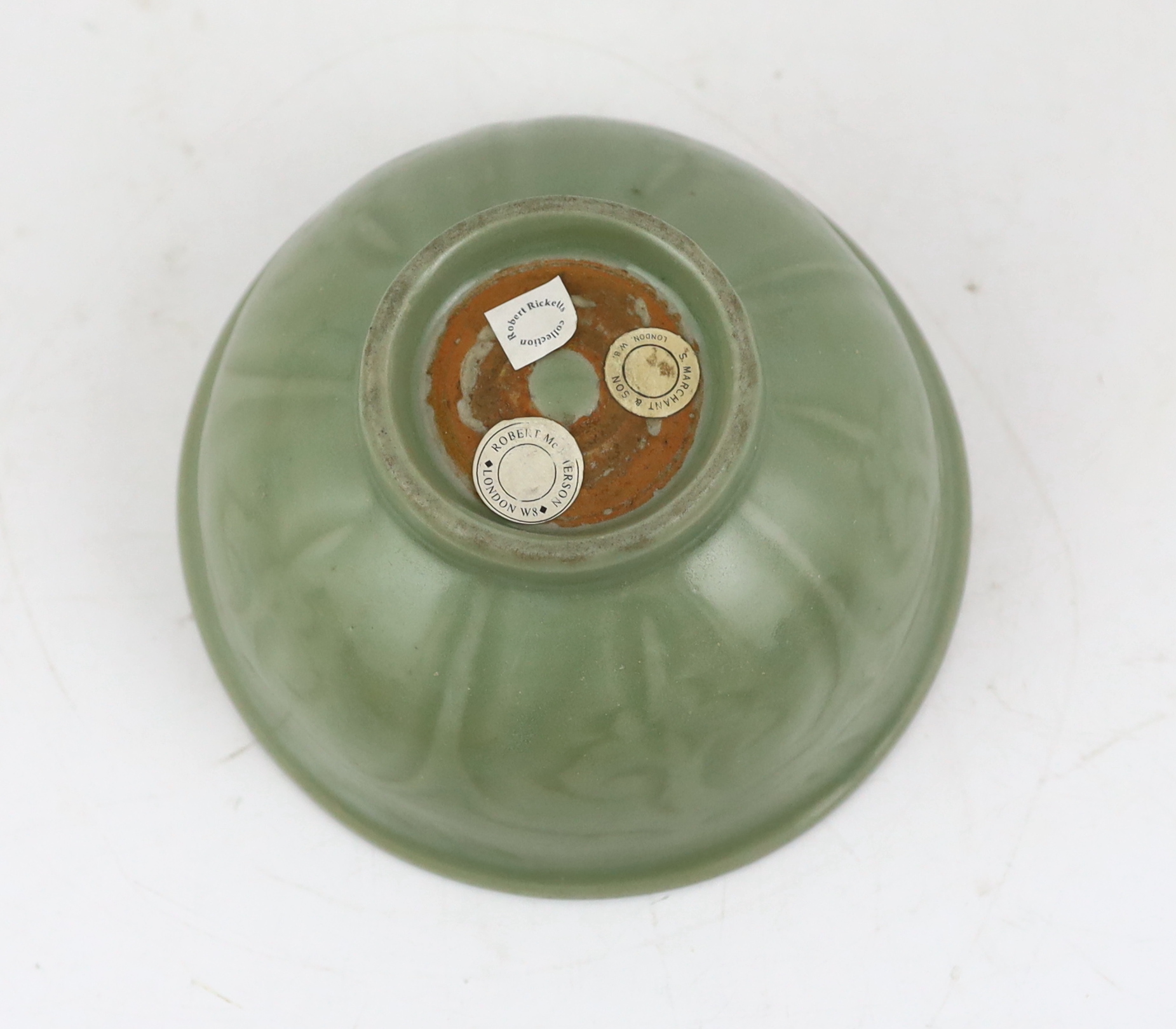 A Chinese Longquan celadon bowl, the interior carved with lotus flowers and the exterior with foliate lappets, 15.2cm diameter., Provenance - Robert Ricketts collection, formerly sold by Robert McPherson, London and S. M